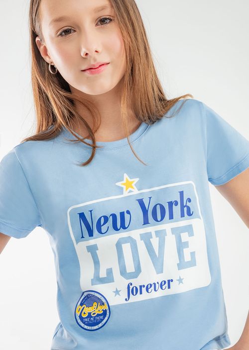 Camiseta azul claro con frente estampado para niñas